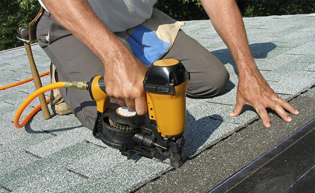 Man repairing roof