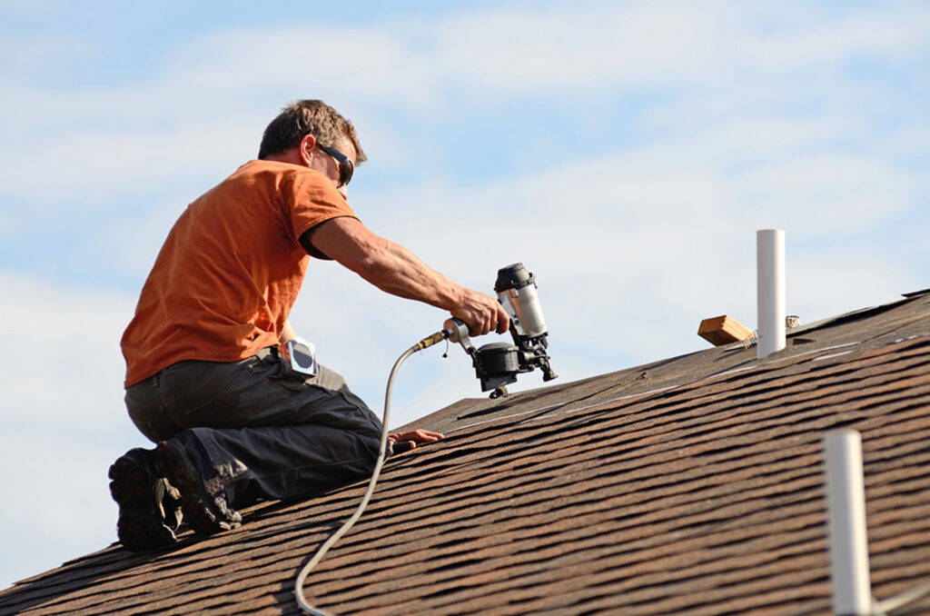 Man repairing roof